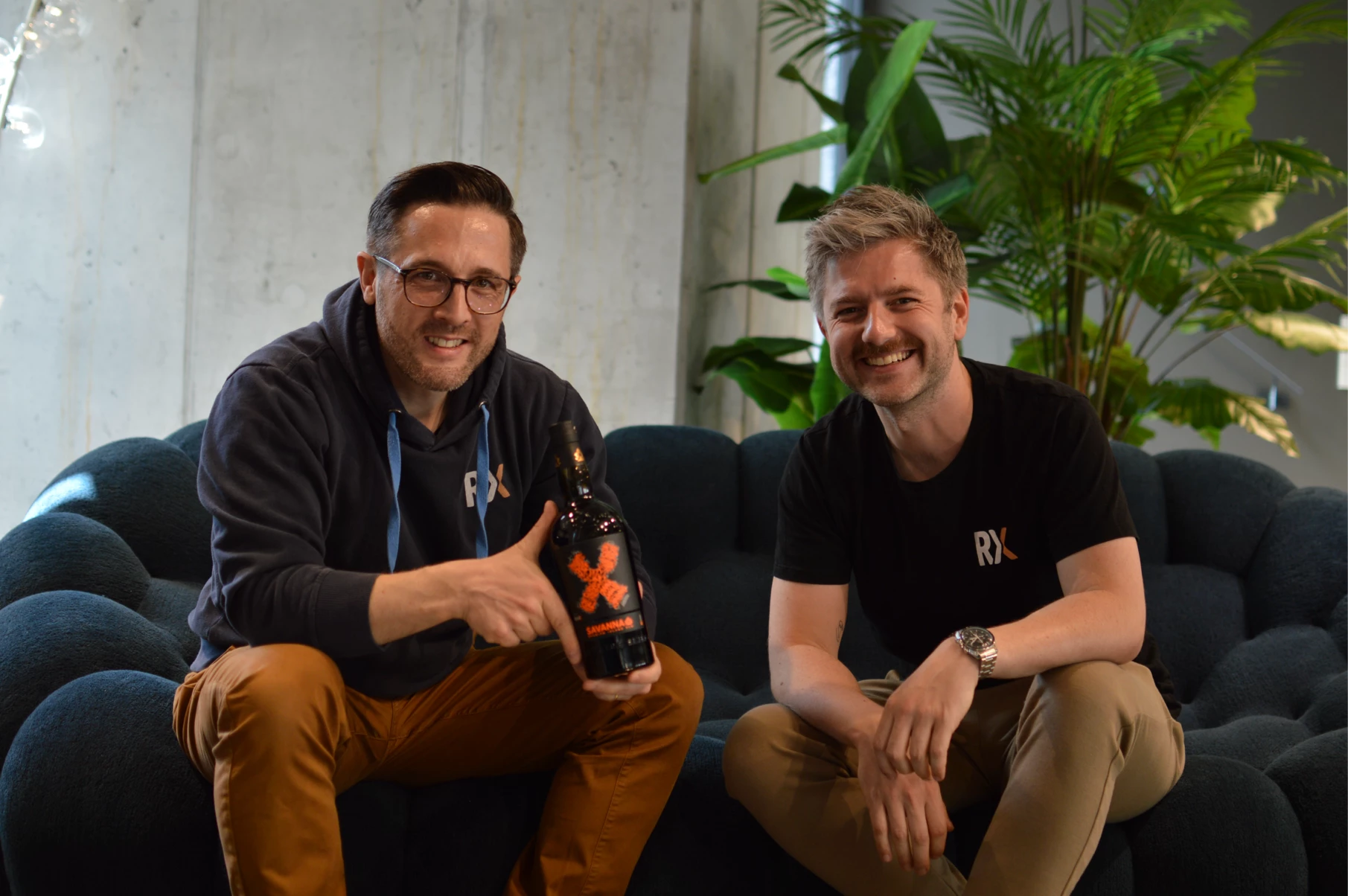 Oliver and Jakob holding the 17-year Savanna × RumX Grand Arôme single cask bottle